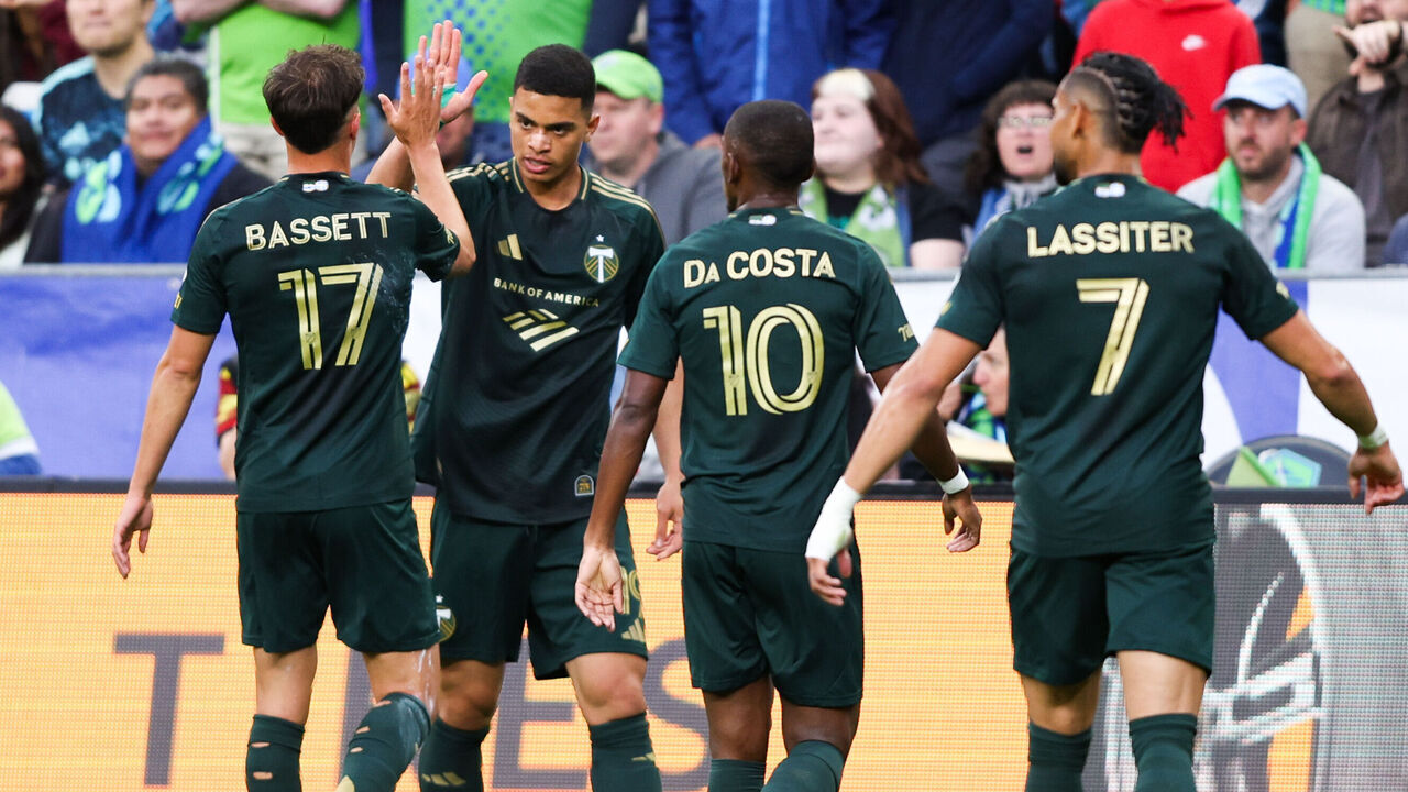 SEATTLE, WASHINGTON - JULY 16: Kevin Kelsy #19 of the Portland Timbers celebrates with teammates after scoring in the first half against the Seattle Sounders FC at Lumen Field on July 16, 2026 in Seattle, Washington.