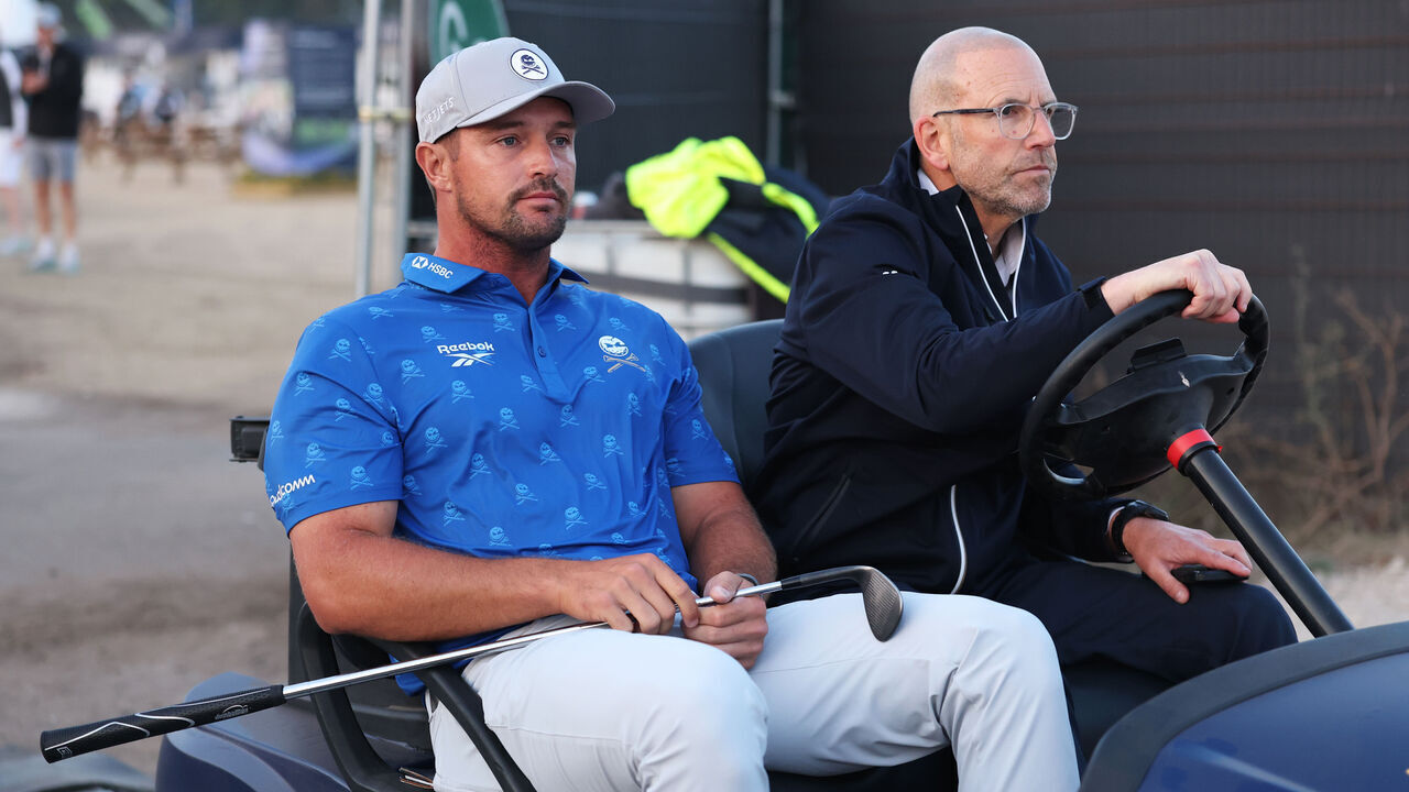 SOUTHPORT, ENGLAND - JULY 17: Bryson DeChambeau of the United States is driven by a rules offical on a buggy following day two of the The 154th Open Championship at Royal Birkdale on July 17, 2026 in Southport, England.