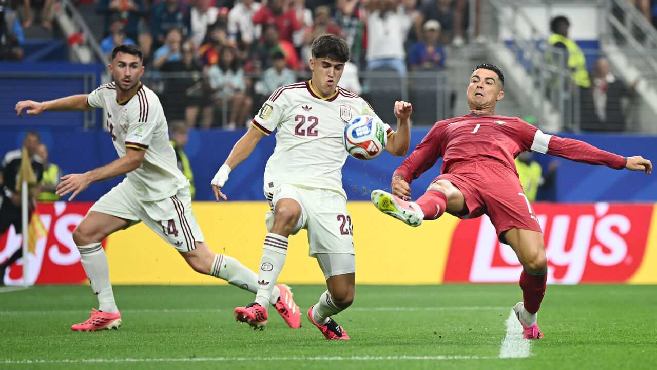ARLINGTON, TEXAS - JULY 06: Cristiano Ronaldo #7 of Portugal competes for the ball against Pau Cubarsi #22 and Aymeric Laporte #14 of Spain during the FIFA World Cup 2026 Round of 16 match between Portugal and Spain at Dallas Stadium on July 06, 2026 in Arlington, Texas.