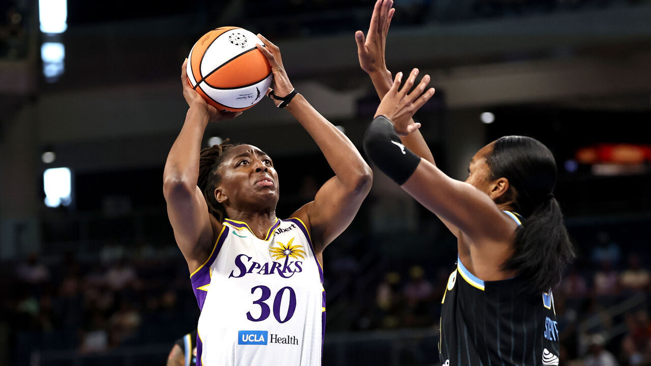 CHICAGO, ILLINOIS - JULY 17: Nneka Ogwumike #30 of the Los Angeles Sparks shoots over Azura Stevens #30 of the Chicago Sky during the first half at Wintrust Arena on July 17, 2026 in Chicago, Illinois.