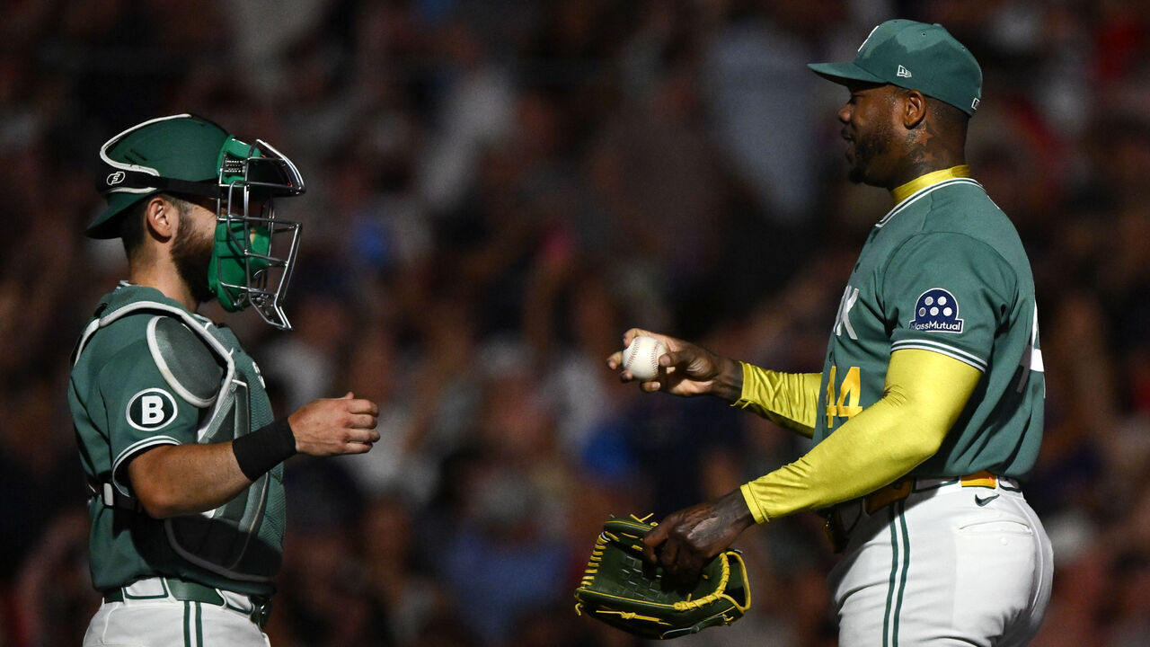 BOSTON, MASSACHUSETTS - JULY 17: Aroldis Chapman #44 of the Boston Red Sox reacts with Connor Wong #12 after game two of the doubleheader against the Tampa Bay Rays at Fenway Park on July 17, 2026 in Boston, Massachusetts.