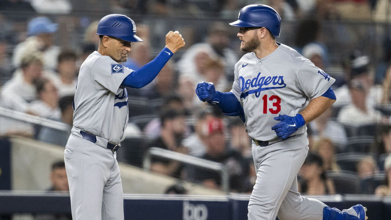 NEW YORK, NY - JULY 17: Max Muncy #13 of the Los Angeles Dodgers celebrates with third base coach Dino Ebel #91 after hitting a home run in the seventh inning during the game between the Los Angeles Dodgers and the New York Yankees at Yankee Stadium on Friday, July 17, 2026 in New York, New York.