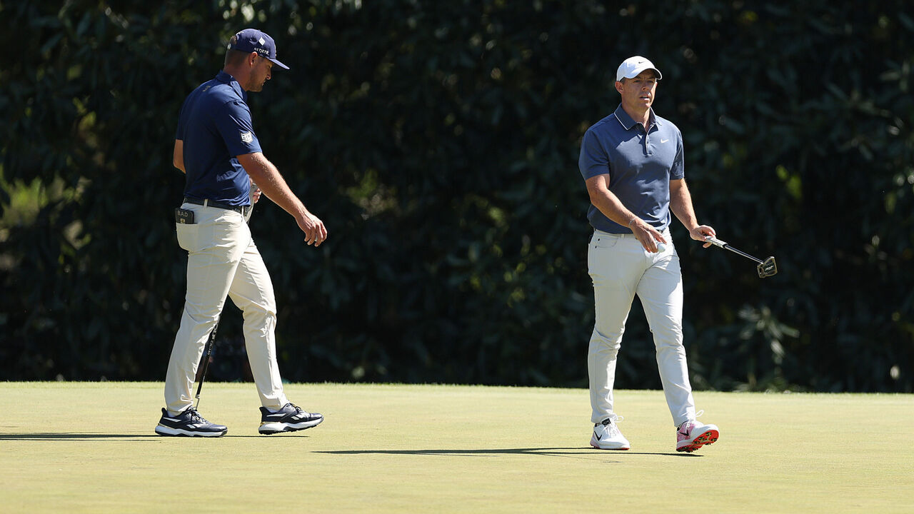 AUGUSTA, GEORGIA - APRIL 13: (L-R) Bryson DeChambeau of the United States and Rory McIlroy of Northern Ireland walk on the fifth green during the final round of the 2025 Masters Tournament at Augusta National Golf Club on April 13, 2025 in Augusta, Georgia.