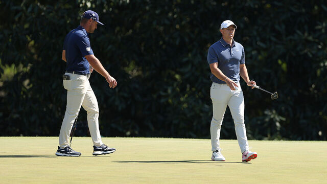 AUGUSTA, GEORGIA - APRIL 13: (L-R) Bryson DeChambeau of the United States and Rory McIlroy of Northern Ireland walk on the fifth green during the final round of the 2025 Masters Tournament at Augusta National Golf Club on April 13, 2025 in Augusta, Georgia.