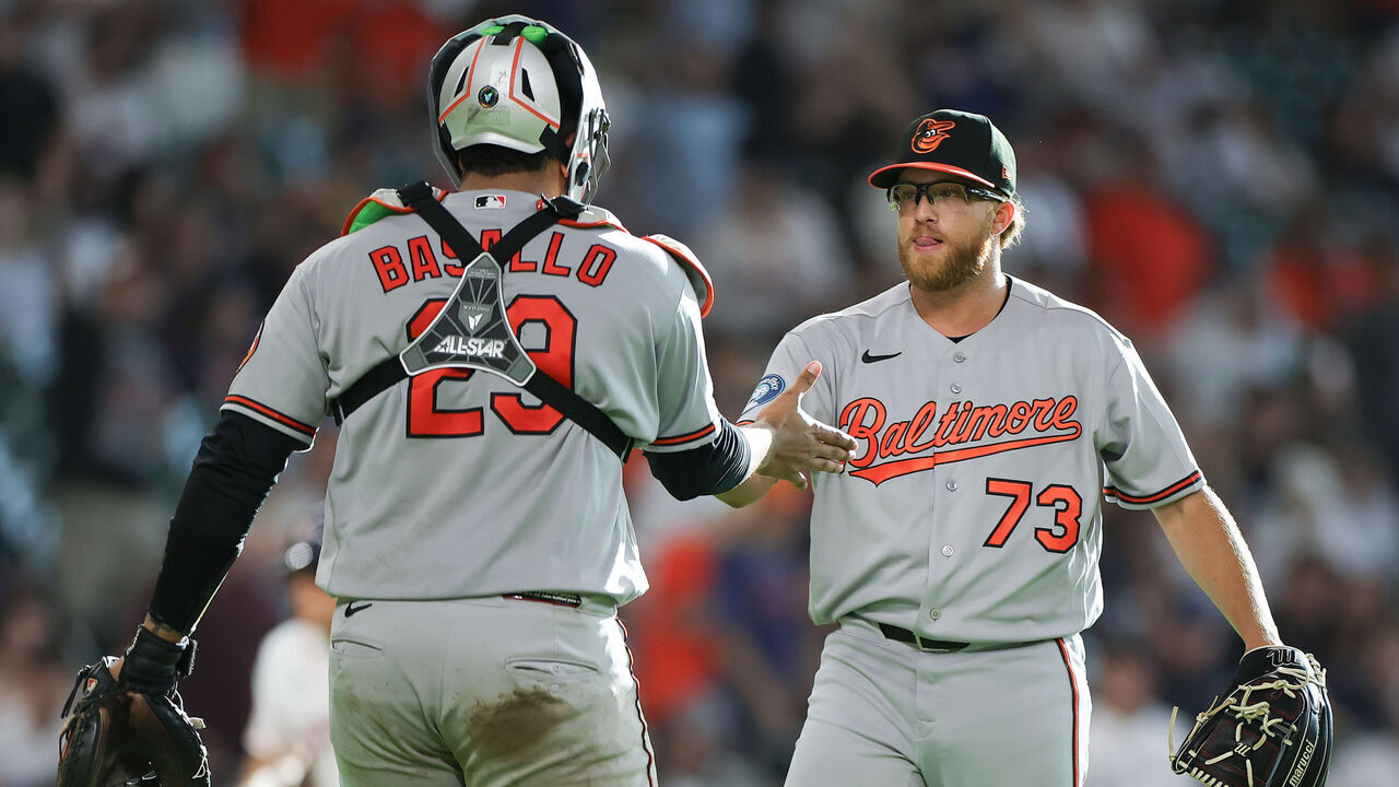 HOUSTON, TEXAS - JULY 18: Cam Sanders #73 and Samuel Basallo #29 of the Baltimore Orioles react after a win against the Houston Astros at Daikin Park on July 18, 2026 in Houston, Texas.