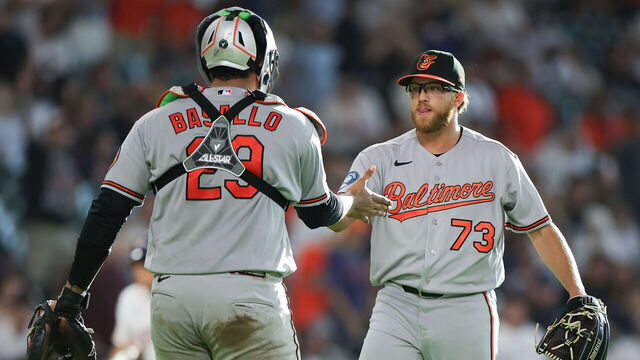 HOUSTON, TEXAS - JULY 18: Cam Sanders #73 and Samuel Basallo #29 of the Baltimore Orioles react after a win against the Houston Astros at Daikin Park on July 18, 2026 in Houston, Texas.