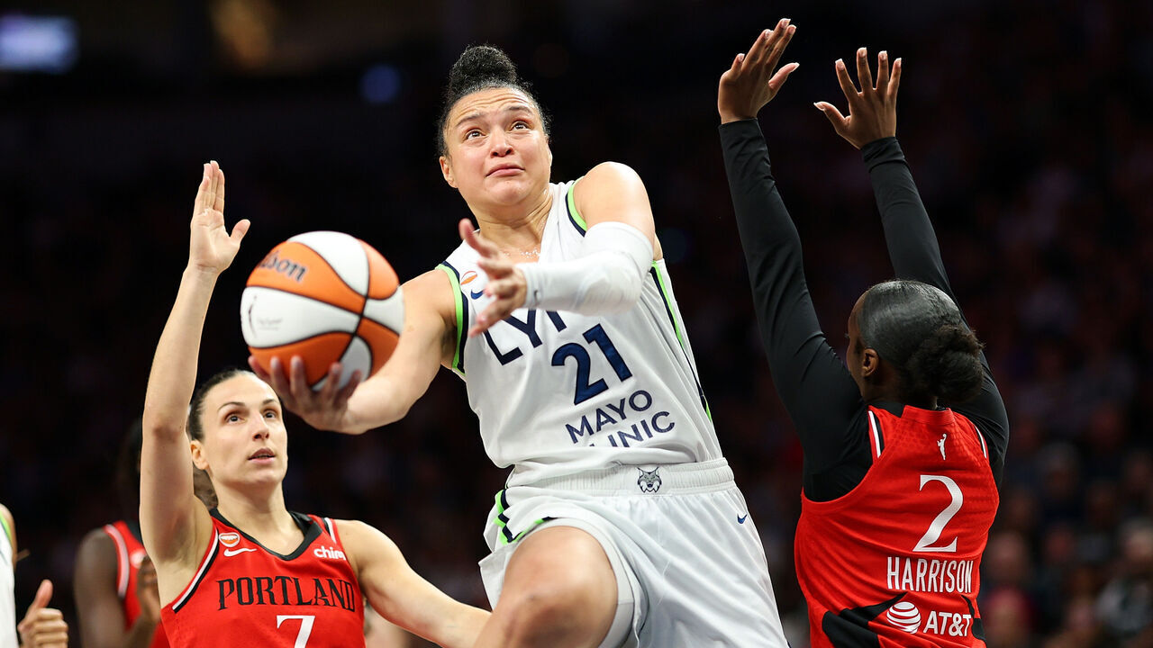 MINNEAPOLIS, MINNESOTA - JULY 18: Kayla McBride #21 of the Minnesota Lynx goes to the basket against Jordan Harrison #2 of the Portland Fire in the second quarter at Target Center on July 18, 2026 in Minneapolis, Minnesota.