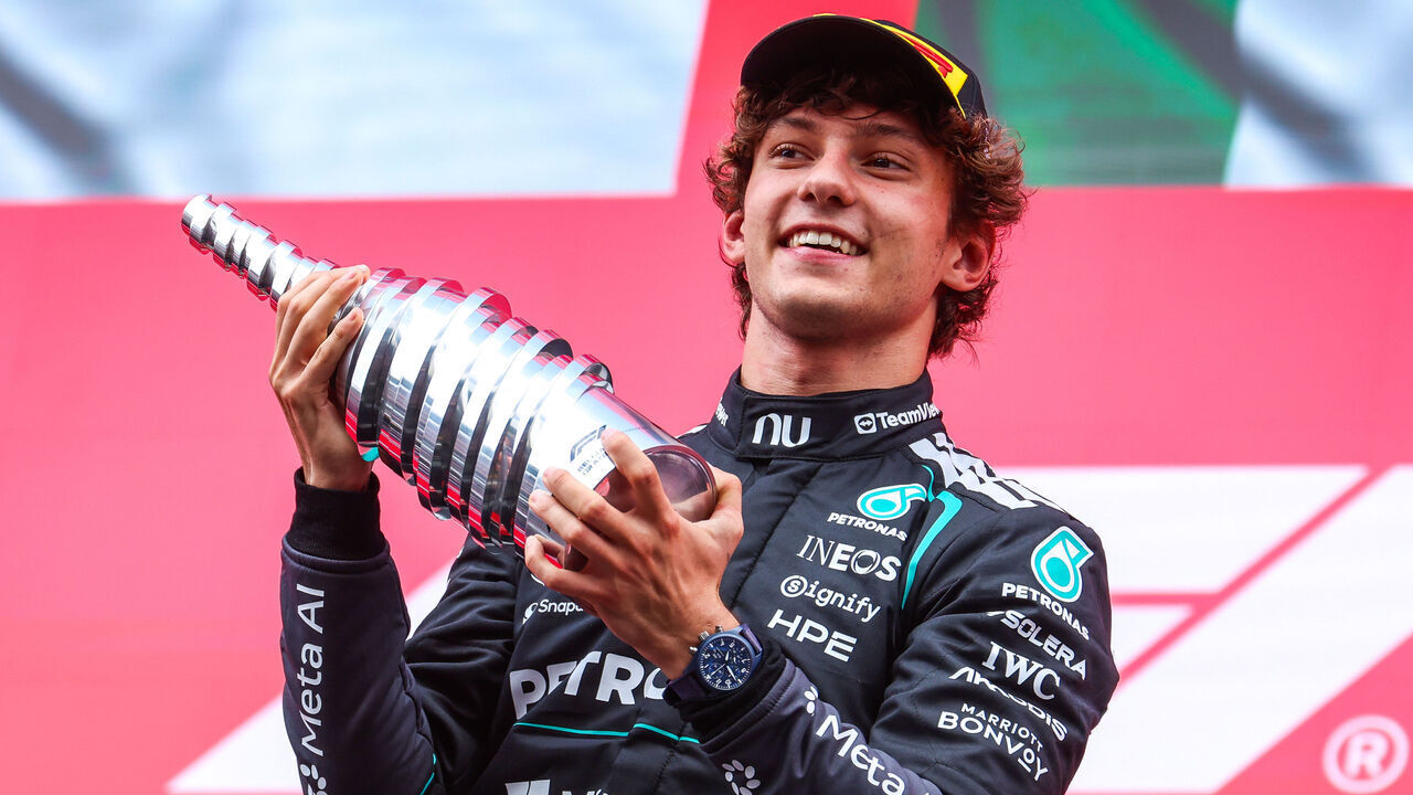 SPA, BELGIUM - JULY 19: Andrea Kimi Antonelli of Italy and Mercedes AMG Petronas F1 Team raises his trophy in the air in celebration on the podium during the F1 Grand Prix of Belgium at Circuit de Spa-Francorchamps on July 19, 2026 in Spa, Belgium.