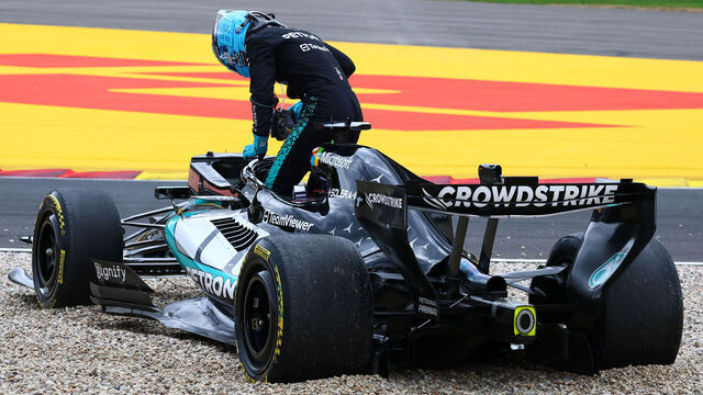 SPA, BELGIUM - JULY 19: George Russell of Great Britain and Mercedes AMG Petronas F1 Team climbs out of his car after a spin into the gravel on the opening lap during the F1 Grand Prix of Belgium at Circuit de Spa-Francorchamps on July 19, 2026 in Spa, Belgium.