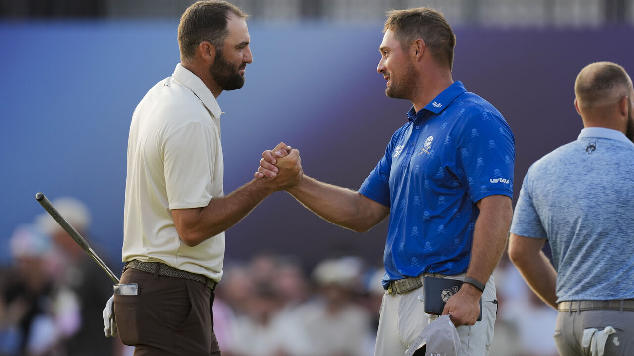 SOUTHPORT, ENGLAND - JULY 17: Bryson DeChambeau shakes hands with Scottie Scheffler on the 18th hole during the second round of The Open Championship at Royal Birkdale Golf Club on July 17, 2026 in Southport, England.