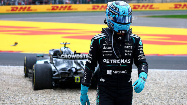 SPA, BELGIUM - JULY 19: George Russell of Great Britain and Mercedes AMG Petronas F1 Team walks away from his car after a crash and retirement on the opening lap during the F1 Grand Prix of Belgium at Circuit de Spa-Francorchamps on July 19, 2026 in Spa, Belgium.