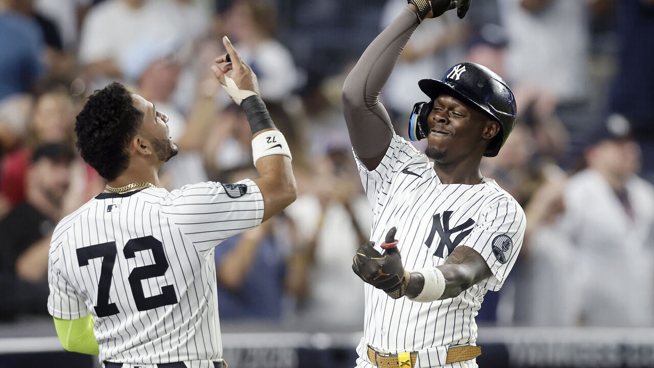 NEW YORK, NEW YORK - JULY 18: Jazz Chisholm Jr. #13 of the New York Yankees celebrates his eighth inning home run against the Los Angeles Dodgers with teammate Jose Caballero #72 in game two of a doubleheader at Yankee Stadium on July 19, 2026 in New York City.