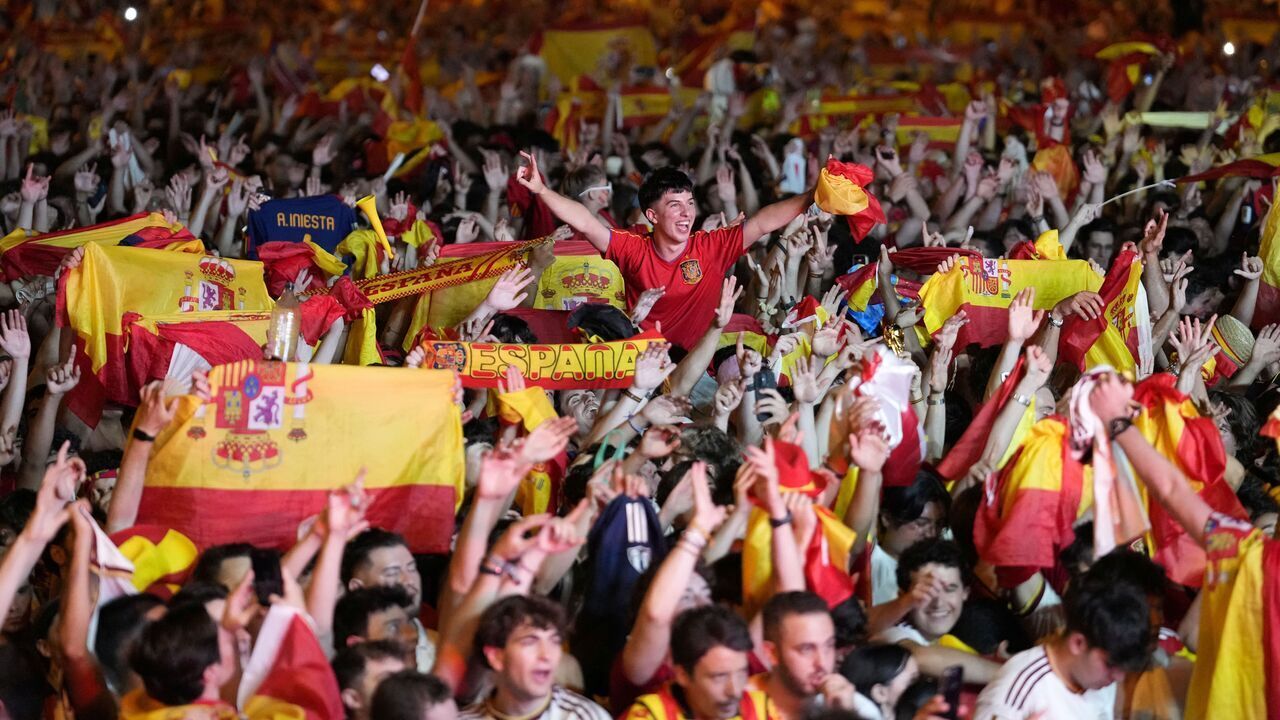 Spain's supporters celebrate victory after the 2026 World Cup final match between Spain and Argentina displayed on giant screens at Colon square's fan zone in Madrid, on July 19, 2026.