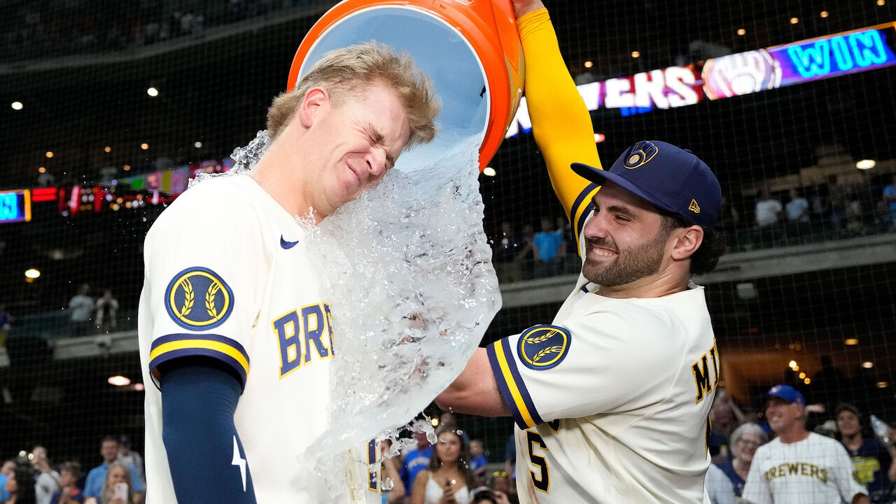MILWAUKEE, WISCONSIN - JULY 20: Cooper Pratt #12 of the Milwaukee Brewers has gatorade dumped on him by Garrett Mitchell #5 after their team's 8-3 win over the New York Mets at American Family Field on July 20, 2026 in Milwaukee, Wisconsin.