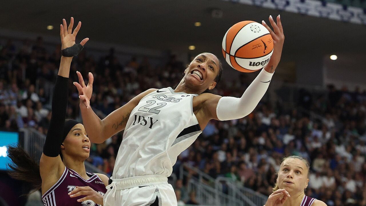 TORONTO, ON - JULY 20 - A'ja Wilson #22 of the Las Vegas Aces hauls in a rebound in front of Isabelle Harrison #21 of the Toronto Tempo as the Toronto Tempo play the Las Vegas Aces at Coca-Cola Coliseum in Toronto. July 20, 2026. Steve Russell/Toronto Star (Steve Russell/Toronto Star via Getty Images)
