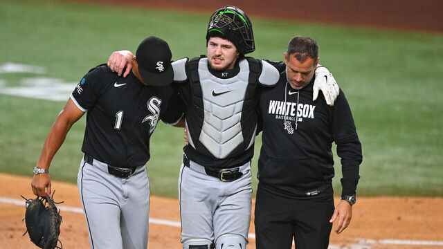 ARLINGTON, TX - JULY 20: Chicago White Sox catcher Kyle Teel (8) is helped off the field by manager Will Venable (1) and the trainer after being injured on a play at the plate during the MLB game between the Chicago White Sox and the Texas Rangers on July 20, 2026 at Globe Life Field in Arlington, CA.