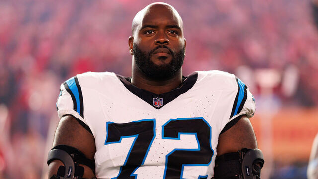 SANTA CLARA, CALIFORNIA - NOVEMBER 24: Taylor Moton #72 of the Carolina Panthers stands on the sidelines during the national anthem prior to an NFL football game against the San Francisco 49ers at Levi's Stadium on November 24, 2025 in Santa Clara, California.