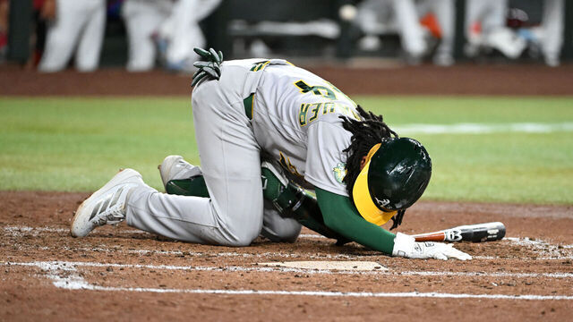 PHOENIX, ARIZONA - JULY 20: Joshua Kuroda-Grauer #44 of the Athletics lays in the batters box after getting hit by a foul ball against the Arizona Diamondbacks during the fifth inning at Chase Field on July 20, 2026 in Phoenix, Arizona.