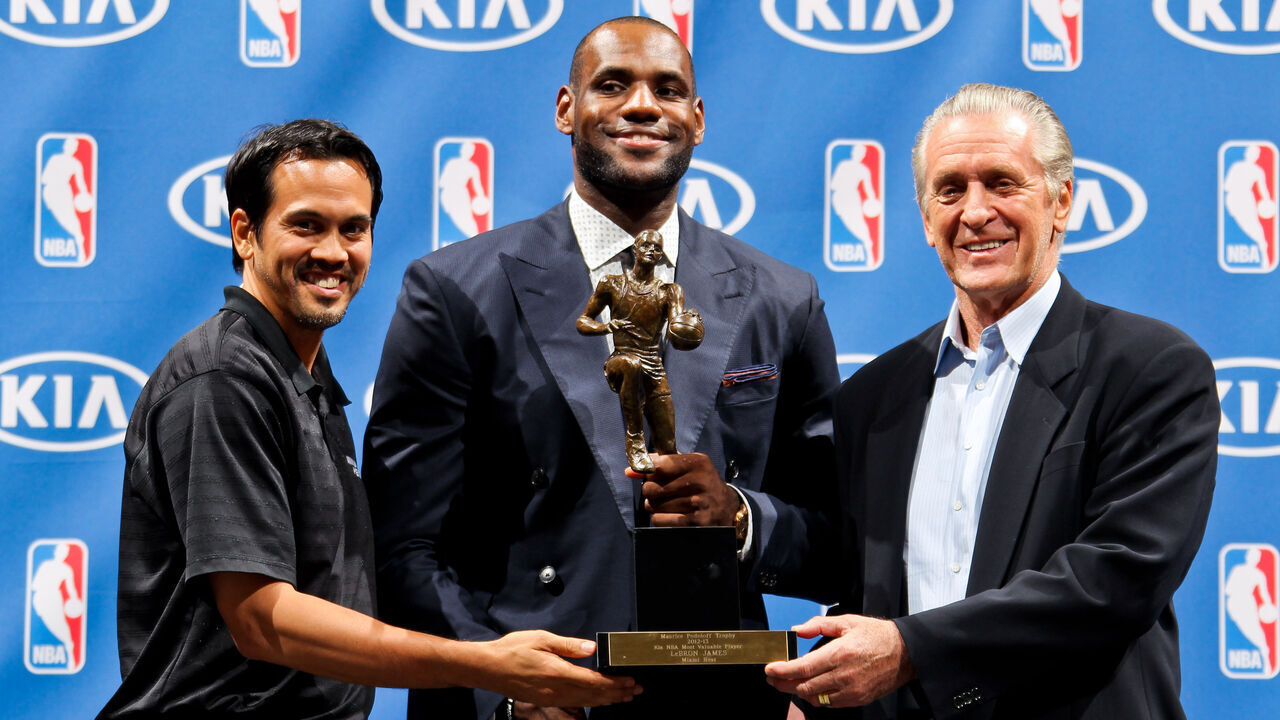 MIAMI, FL - MAY 5: LeBron James #6 of the Miami Heat, center, holds the Maurice Podoloff Trophy while posing with head coach Erik Spoelstra, left, and team president Pat Riley after being named the 2012-2013 Kia NBA Most Valuable Player (MVP) of the Year on May 5, 2013 at American Airlines Arena in Miami, Florida. Mandatory Copyright Notice: Copyright 2013 NBAE