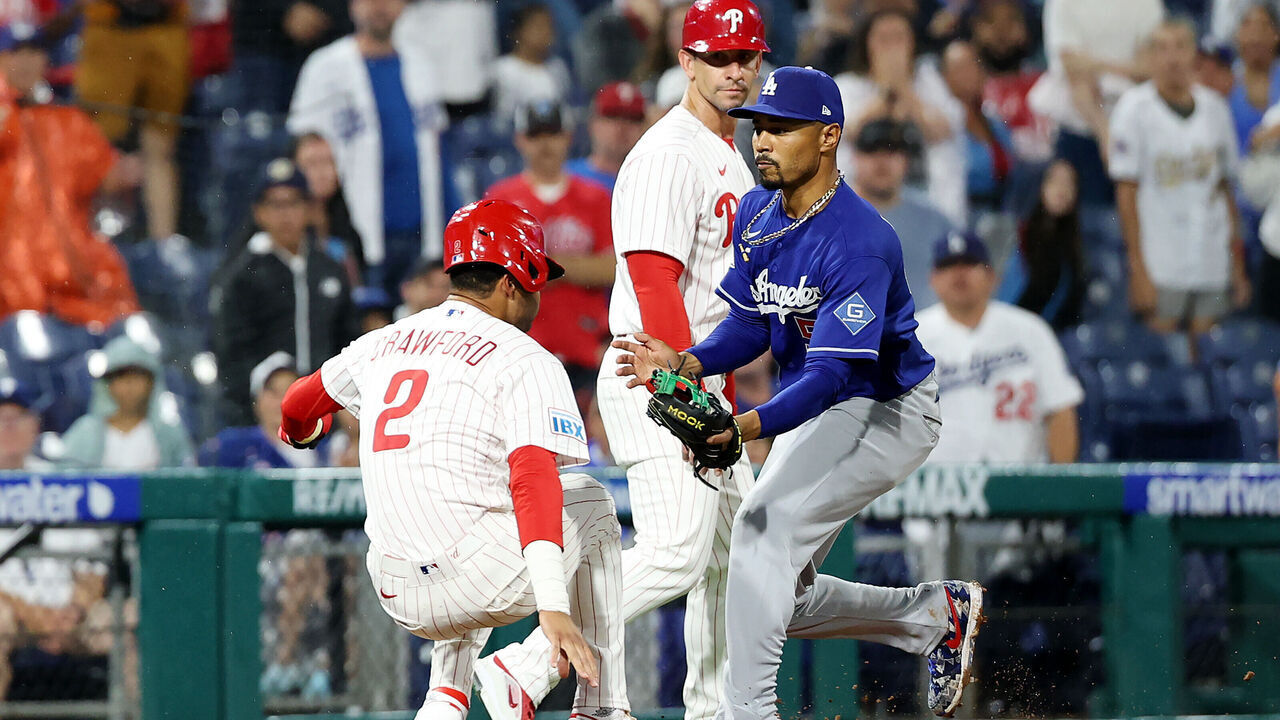 PHILADELPHIA, PENNSYLVANIA - JULY 21: Mookie Betts #50 of the Los Angeles Dodgers tags out Justin Crawford #2 of the Philadelphia Phillies for a double play in the ninth inning at Citizens Bank Park on July 21, 2026 in Philadelphia, Pennsylvania.