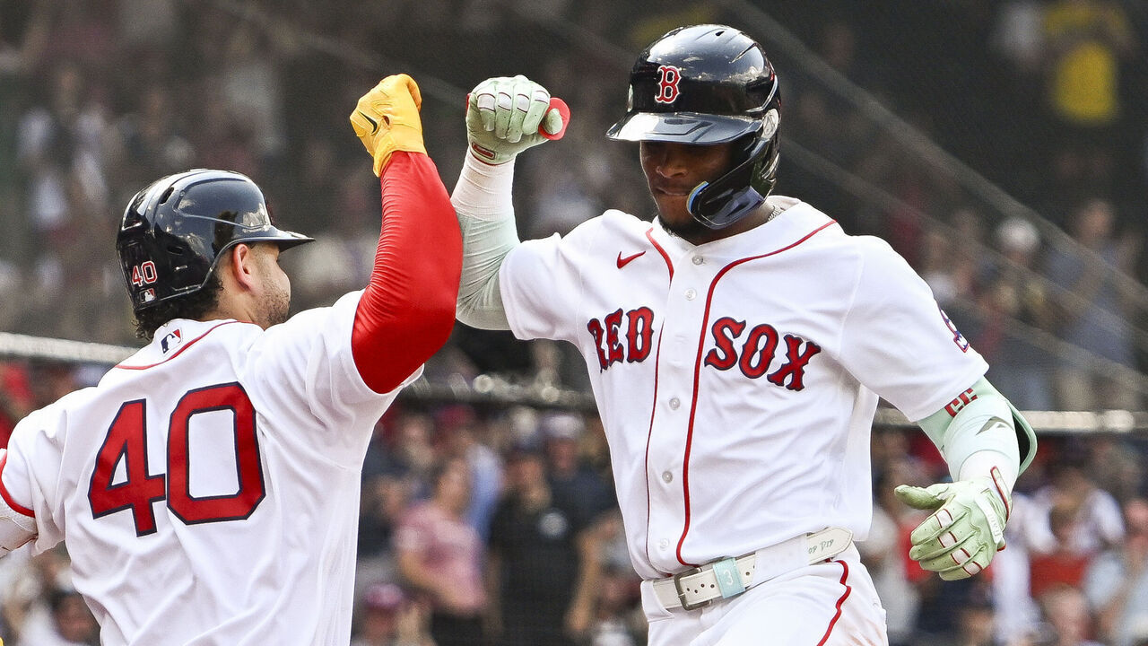 BOSTON, MASSACHUSETTS - JULY 22: Willson Contreras #40 of the Boston Red Sox celebrates with Ceddanne Rafaela #3 at home after hitting a solo home run in the fourth inning against the Baltimore Orioles during game one of a doubleheader at Fenway Park on July 22, 2026 in Boston, Massachusetts.