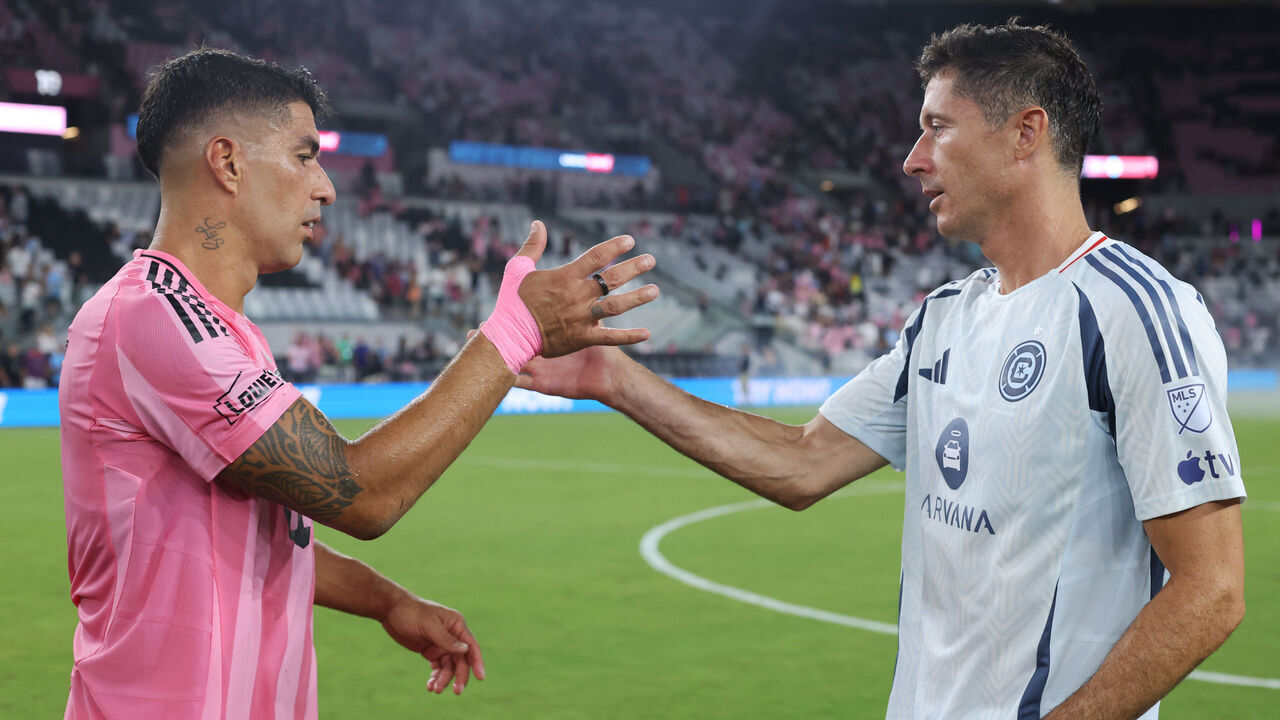MIAMI, FLORIDA - JULY 22: Luis Suárez #9 of Inter Miami CF greets Robert Lewandowski #9 of Chicago Fire after the MLS match between Inter Miami CF and Chicago Fire FC at Nu Stadium on July 22, 2026 in Miami, Florida.