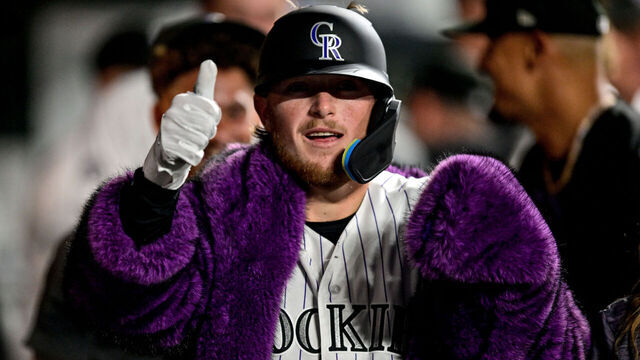 DENVER, COLORADO - JULY 21: Hunter Goodman #15 of the Colorado Rockies celebrates in the dugout after his eighth inning solo home run against the Washington Nationals at Coors Field on July 21, 2026 in Denver, Colorado.