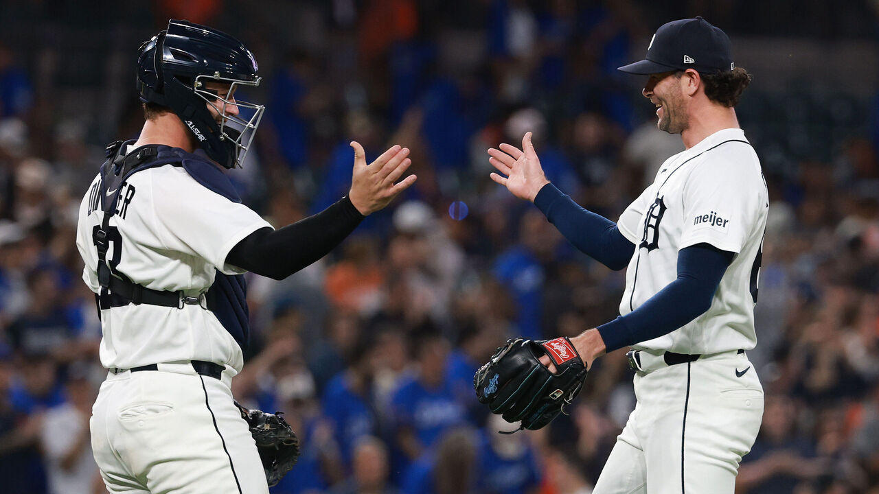 DETROIT, MICHIGAN - JULY 23: Kyle Finnegan #67 of the Detroit Tigers celebrates a 4-3 win over the Kansas City Royals with Dillon Dingler #13 at Comerica Park on July 23, 2026 in Detroit, Michigan.