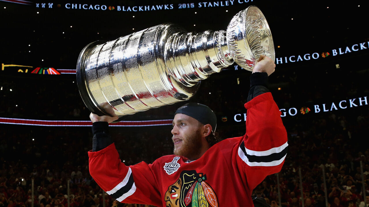 CHICAGO, IL - JUNE 15: Patrick Kane #88 of the Chicago Blackhawks lifts the Stanley Cup in celebration after his team defeated the Tampa Bay Lightning 2-0 in Game Six of the 2015 NHL Stanley Cup Final at the United Center on June 15, 2015 in Chicago, Illinois.