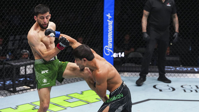 ABU DHABI, UNITED ARAB EMIRATES - JULY 24: Ramazan Temirov throws a punch against Steve Erceg in their flyweight fight during the UFC Fight Night event at Etihad Arena July 24, 2026 in Yas Island, Abu Dhabi, United Arab Emirates.