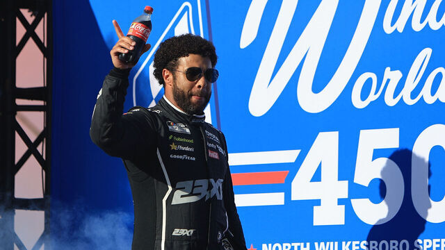 NORTH WILKESBORO, NC - JULY 19: Bubba Wallace (#23 23XI Racing Coca-Cola Toyota) waves to the fans prior to the running of the NASCAR Cup Series Window World 450 on July 19, 2026 at North Wilkesboro Speedway in North Wilkesboro, NC.