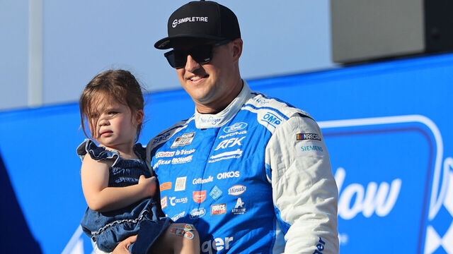 NORTH WILKESBORO, NC - JULY 19: Ryan Preece (#60 RFK Racing SimpleTire Ford) walks out on the driver introduction stage with his daughter Rebecca Marie prior to the running of the NASCAR Cup Series Window World 450 on July 19, 2026 at North Wilkesboro Speedway in North Wilkesboro, NC.