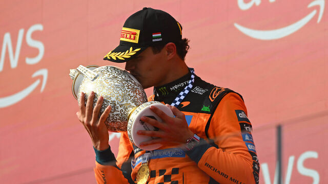 BUDAPEST, HUNGARY - JULY 26: Race winner Lando Norris of Great Britain and McLaren kisses his trophy on the podium during the F1 Grand Prix of Hungary at Hungaroring on July 26, 2026 in Budapest, Hungary.