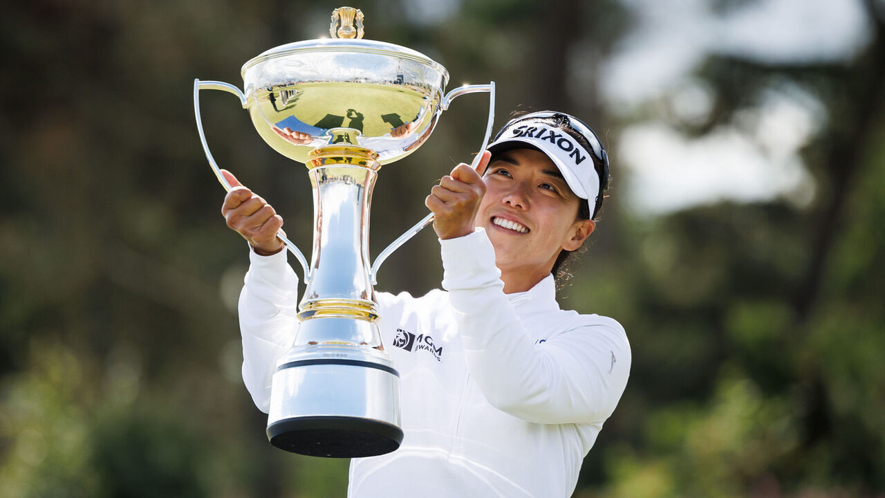 TROON, SCOTLAND - JULY 26: Jenny Shin of South Korea lifts the trophy after winning the tournament during the final round of the 2026 ISPS HANDA Women's Scottish Open at Dundonald Links, on July 26, 2026, in Troon, Scotland.