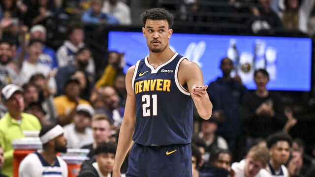 DENVER , CO - APRIL 27: Spencer Jones (21) of the Denver Nuggets cooly celebrates after hitting a three pointer against the Minnesota Timberwolves during the third quarter of game five of their NBA Playoffs series on Monday, April 27, 2026.