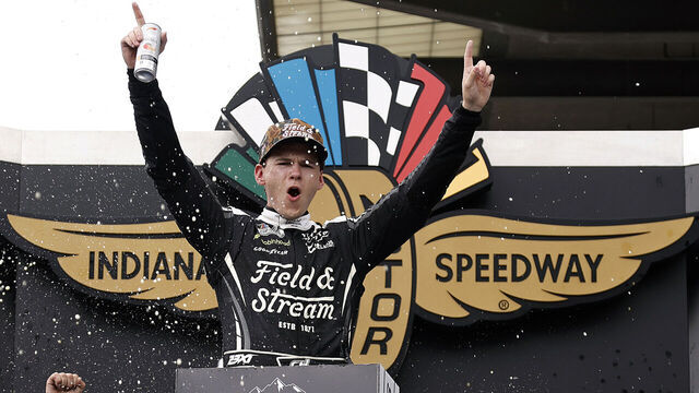 INDIANAPOLIS, INDIANA - JULY 26: Corey Heim, driver of the #67 Field & Stream Toyota, celebrates in victory lane after winning the NASCAR Cup Series Brickyard 400 at Indianapolis Motor Speedway on July 26, 2026 in Indianapolis, Indiana.