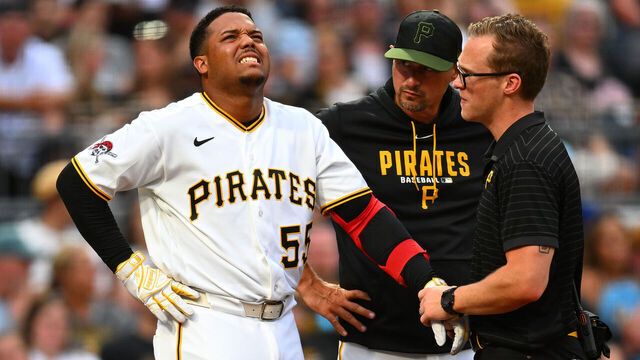 PITTSBURGH, PENNSYLVANIA - JULY 27: Esmerlyn Valdez #55 of the Pittsburgh Pirates reacts, while being examined by training staff, after being hit by a pitch during the fourth inning against the Arizona Diamondbacks at PNC Park on July 27, 2026 in Pittsburgh, Pennsylvania.