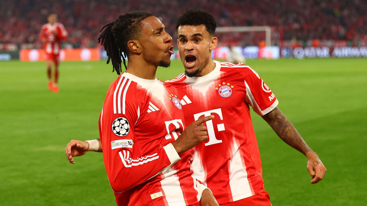 MUNICH, GERMANY - APRIL 15: Michael Olise of Bayern Munich celebrates scoring his side's fourth goal with team-mate Luis Diaz during the UEFA Champions League 2025/26 Quarter-Final Second Leg match between FC Bayern München and Real Madrid CF at Football Arena Munich on April 15, 2026 in Munich, Germany.