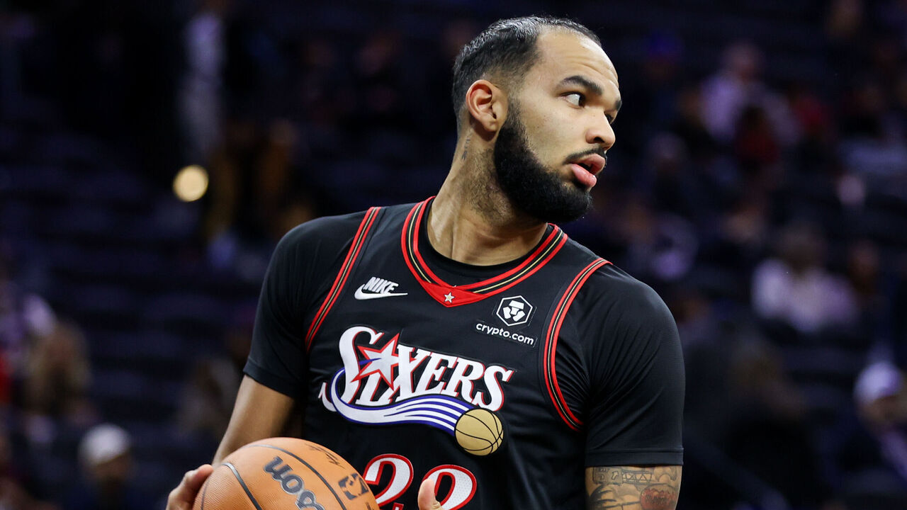PHILADELPHIA, PENNSYLVANIA - NOVEMBER 23: Johni Broome #22 of the Philadelphia 76ers handles the ball against the Miami Heat at Xfinity Mobile Arena on November 23, 2025 in Philadelphia, Pennsylvania.
