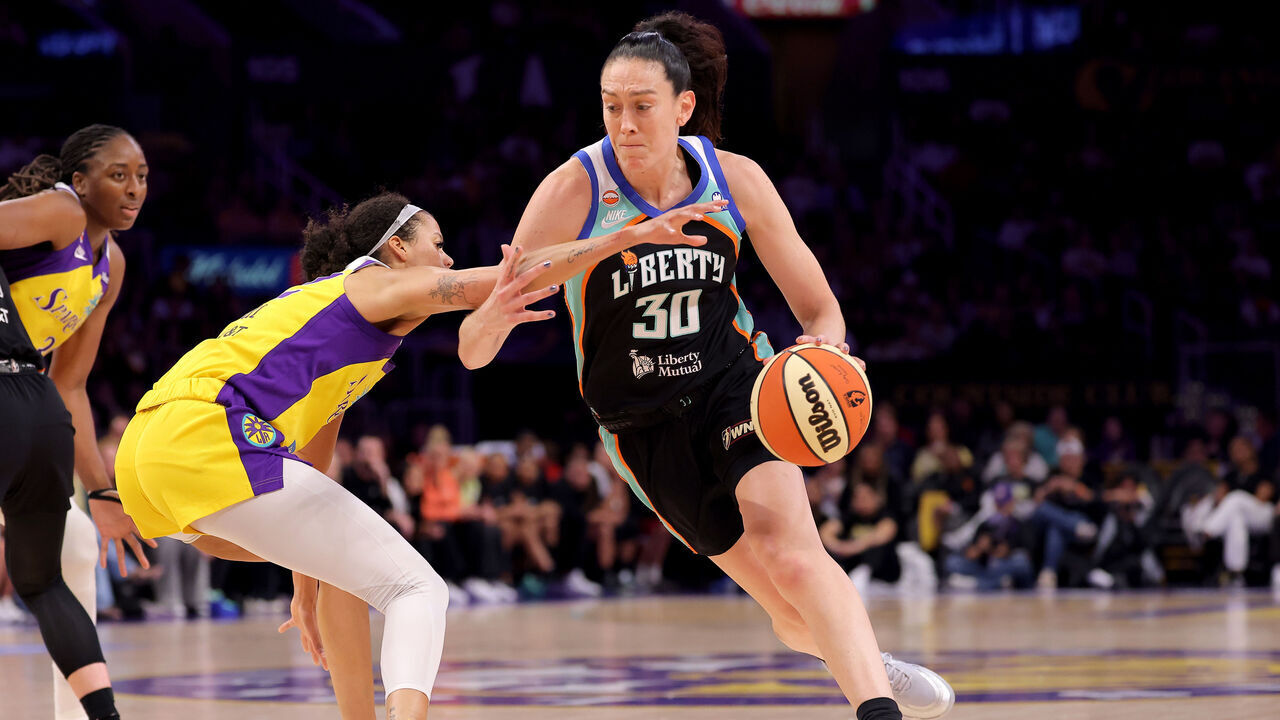 LOS ANGELES, CALIFORNIA - JULY 28: Breanna Stewart #30 of the New York Liberty drives past Rae Burrell #12 of the Los Angeles Sparks during the first quarter at Crypto.com Arena on July 28, 2026 in Los Angeles, California. NOTE TO USER: User expressly acknowledges and agrees that, by downloading and/or using this photograph, user is consenting to the terms and conditions of the Getty Images License Agreement.