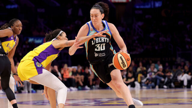 LOS ANGELES, CALIFORNIA - JULY 28: Breanna Stewart #30 of the New York Liberty drives past Rae Burrell #12 of the Los Angeles Sparks during the first quarter at Crypto.com Arena on July 28, 2026 in Los Angeles, California. NOTE TO USER: User expressly acknowledges and agrees that, by downloading and/or using this photograph, user is consenting to the terms and conditions of the Getty Images License Agreement.