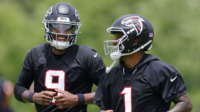 FLOWERY BRANCH, GEORGIA - MAY 27: Michael Penix Jr. #9 and Tua Tagovailoa #1 of the Atlanta Falcons have a laugh during OTA's at IBM Performance Field on May 27, 2026 in Flowery Branch, Georgia.