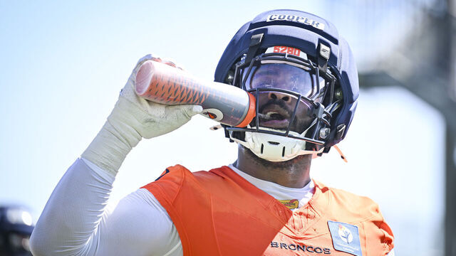 CENTENNIAL , CO - JULY 29: Jonathon Cooper (0) of the Denver Broncos takes a drink during practice at the Broncos Park in Centennial, Colorado on Wednesday, July 29, 2026.