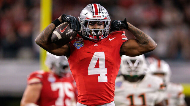 ARLINGTON, TX - DECEMBER 31: WR Jeremiah Smith #4 of the Ohio State Buckeyes reacts after a play during the first half abasing Miami Hurricanes on December 31st, 2025 during the College Football Playoff Quarterfinal at the Goodyear Cotton Bowl Classic Miami vs Ohio State at ATT Stadium in Arlington, Tx.