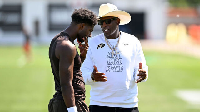 BEREA, OHIO - JULY 30: Head coach Deion Sanders of the Colorado Buffaloes talks with his son Shedeur Sanders #2 of the Cleveland Browns after the Cleveland Browns Training Camp at CrossCountry Mortgage Campus on July 30, 2026 in Berea, Ohio.