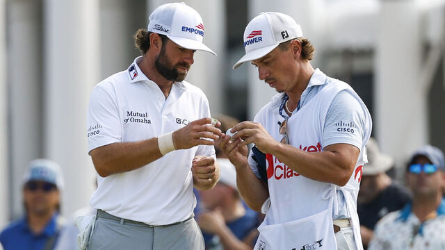 DETROIT, MICHIGAN - JULY 31: Cameron Young of the United States concentrates on his golf with ball with caddie Kyle Sterbinksy on the second green during the second round of the Rocket Classic 2026 at Detroit Golf Club on July 31, 2026 in Detroit, Michigan.