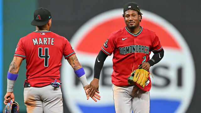 CLEVELAND, OHIO - JULY 31: Ketel Marte #4 celebrates with Geraldo Perdomo #2 of the Arizona Diamondbacks after the game against the Cleveland Guardians at Progressive Field on July 31, 2026 in Cleveland, Ohio. The Diamondbacks defeated the Guardians 4-1.