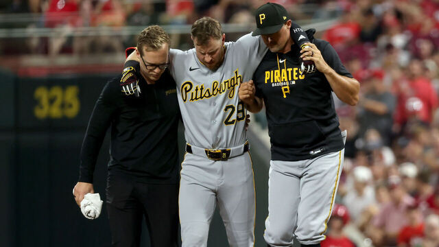 CINCINNATI, OHIO - JULY 31: Ryan O'Hearn #29 of the Pittsburgh Pirates is helped off of the field after sustaining an injury during the ninth inning of the game against the Cincinnati Reds at Great American Ball Park on July 31, 2026 in Cincinnati, Ohio. Cincinnati defeated Pittsburgh 8-7.