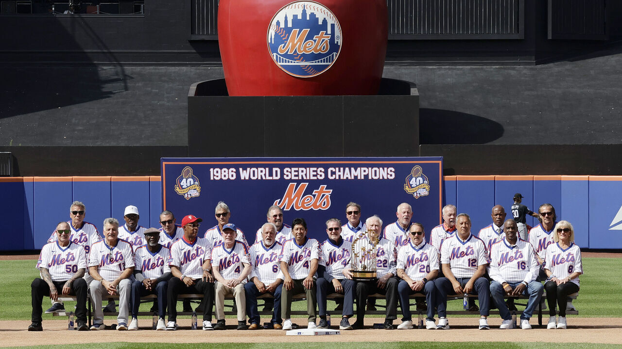 NEW YORK, NEW YORK - AUGUST 01: Members of the 1986 New York Mets pose for a photograph after a ceremony honoring their World Series Championship prior to a game between the Mets and the Miami Marlins at Citi Field on August 01, 2026 in New York City.