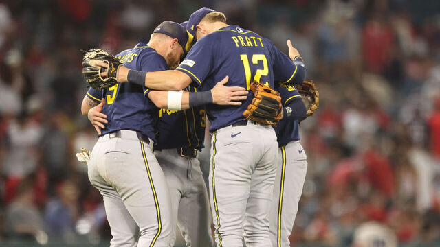ANAHEIM, CALIFORNIA - AUGUST 01: Cooper Pratt #12 of the Milwaukee Brewers and teammates celebrate after defeating the Los Angeles Angels at Angel Stadium of Anaheim on August 01, 2026 in Anaheim, California.